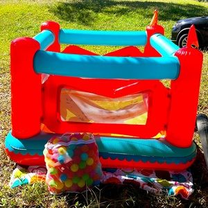 Children bounce house with balls